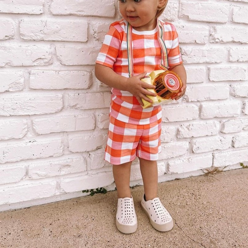 A modern curbside pickup service showcasing a vehicle parked outside a store, ready for order collection.
