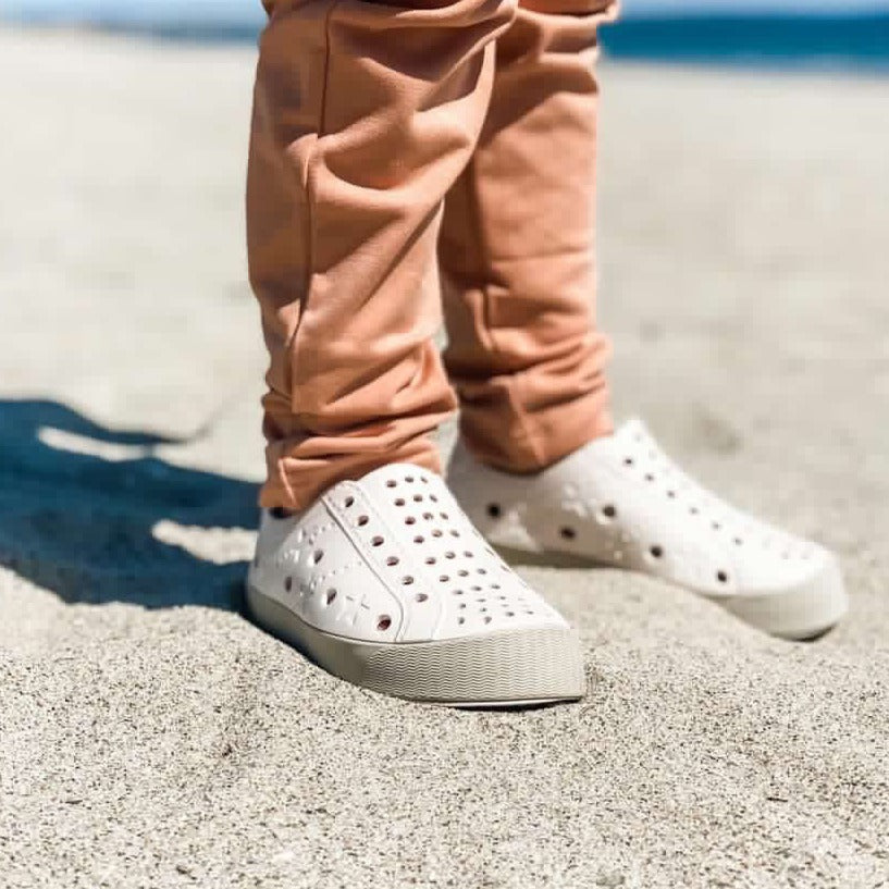 A modern curbside pickup service showcasing a vehicle parked outside a store, ready for order collection.