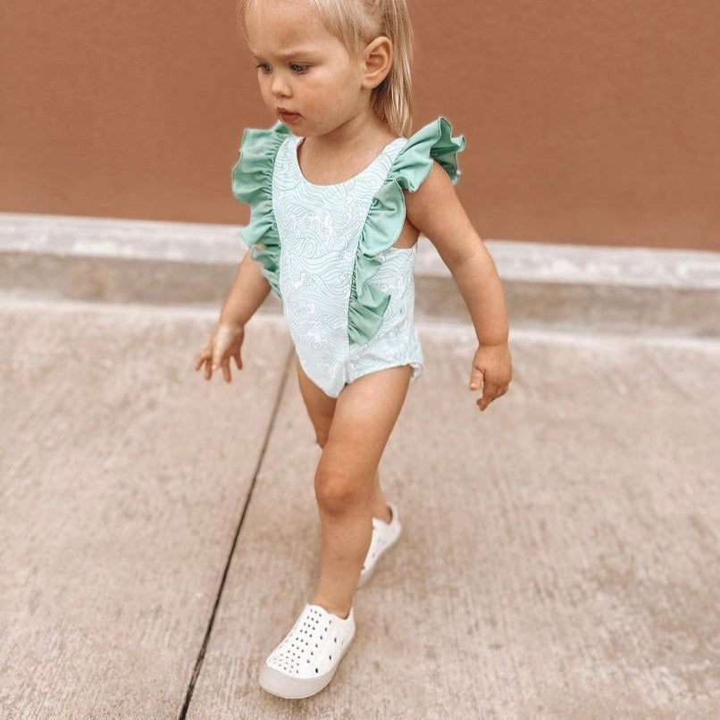 A modern curbside pickup service showcasing a vehicle parked outside a store, ready for order collection.