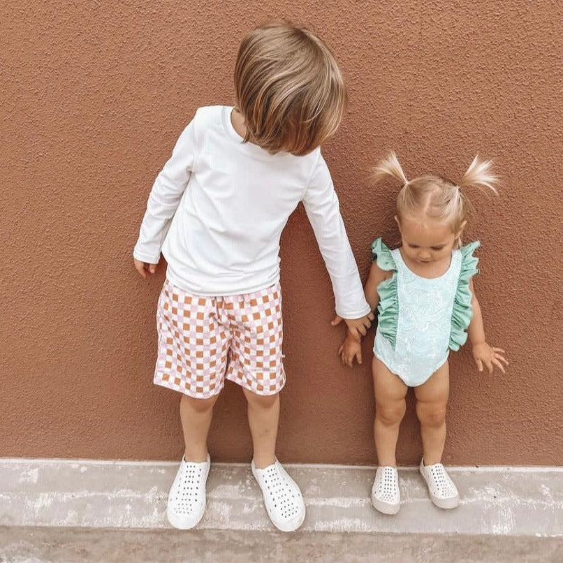 A modern curbside pickup service showcasing a vehicle parked outside a store, ready for order collection.