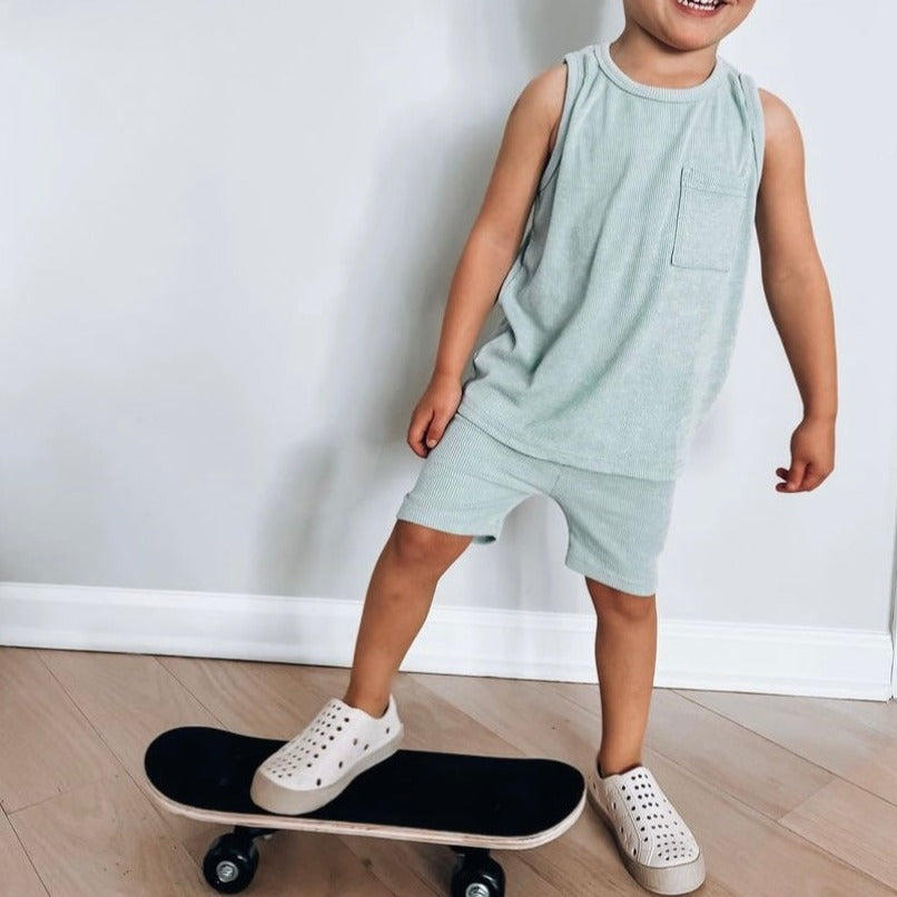 A modern curbside pickup service showcasing a vehicle parked outside a store, ready for order collection.