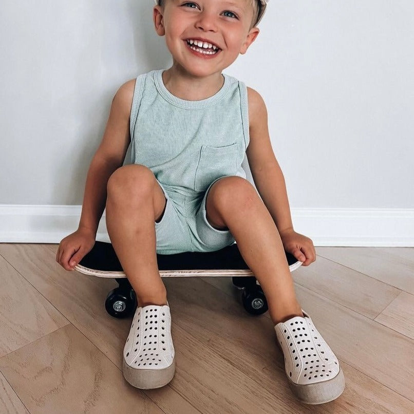 A modern curbside pickup service showcasing a vehicle parked outside a store, ready for order collection.