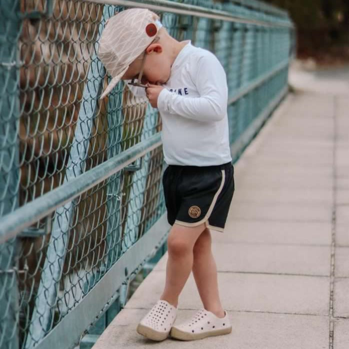 A modern curbside pickup service showcasing a vehicle parked outside a store, ready for order collection.