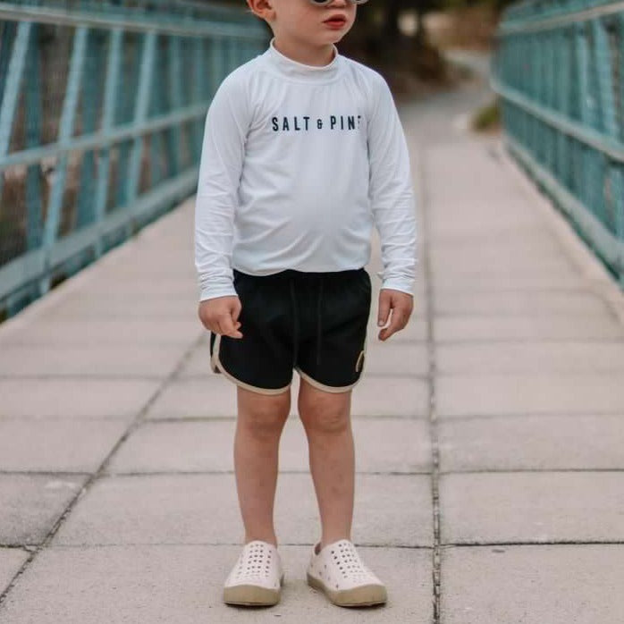 A modern curbside pickup service showcasing a vehicle parked outside a store, ready for order collection.