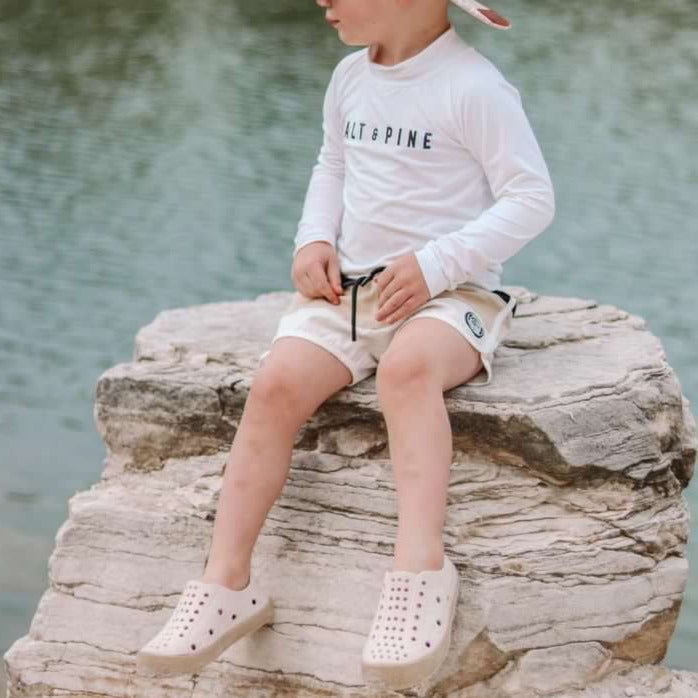 A modern curbside pickup service showcasing a vehicle parked outside a store, ready for order collection.