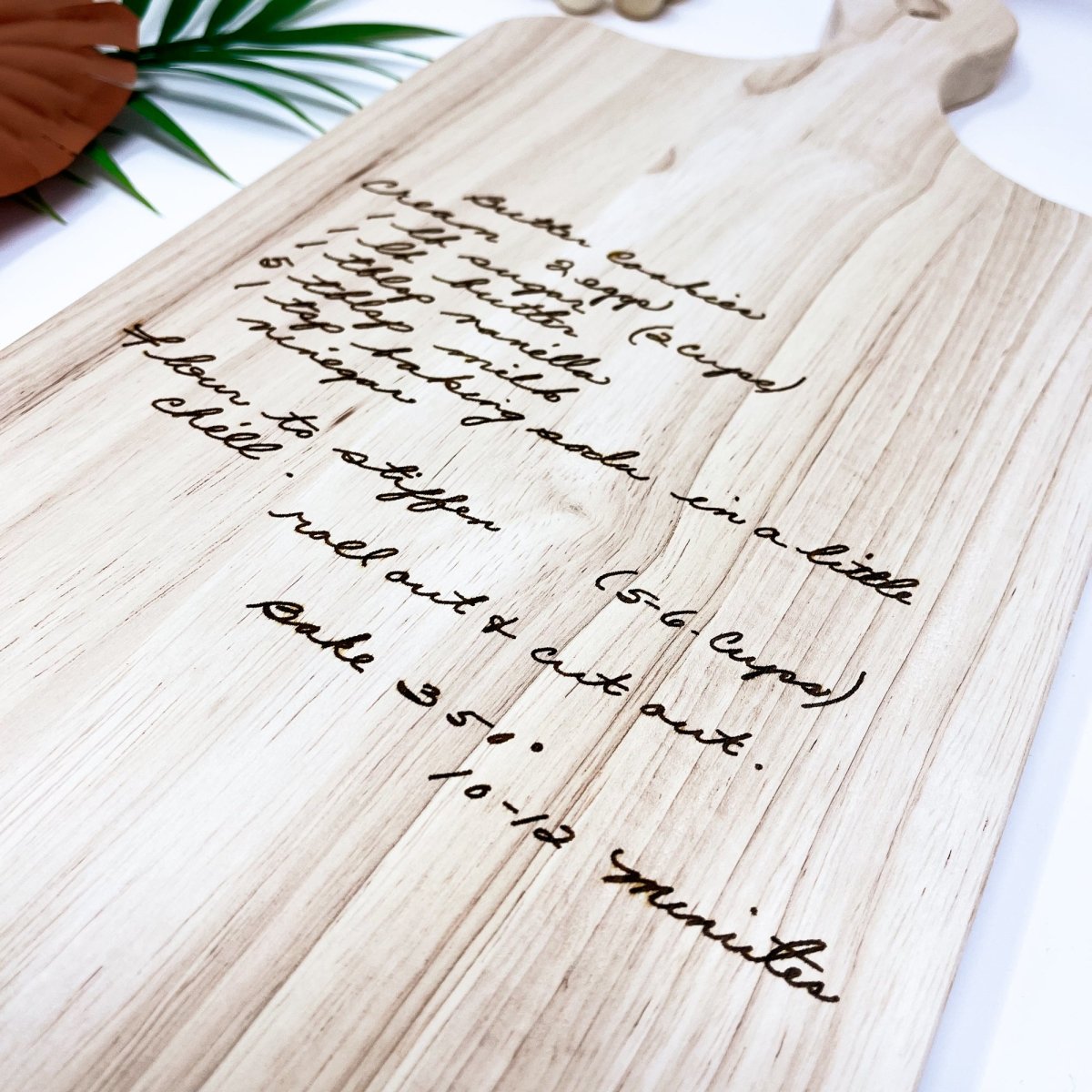 Custom Handwritten Cutting Board featuring a personalized handwritten recipe and decorative design, showcasing its unique craftsmanship.