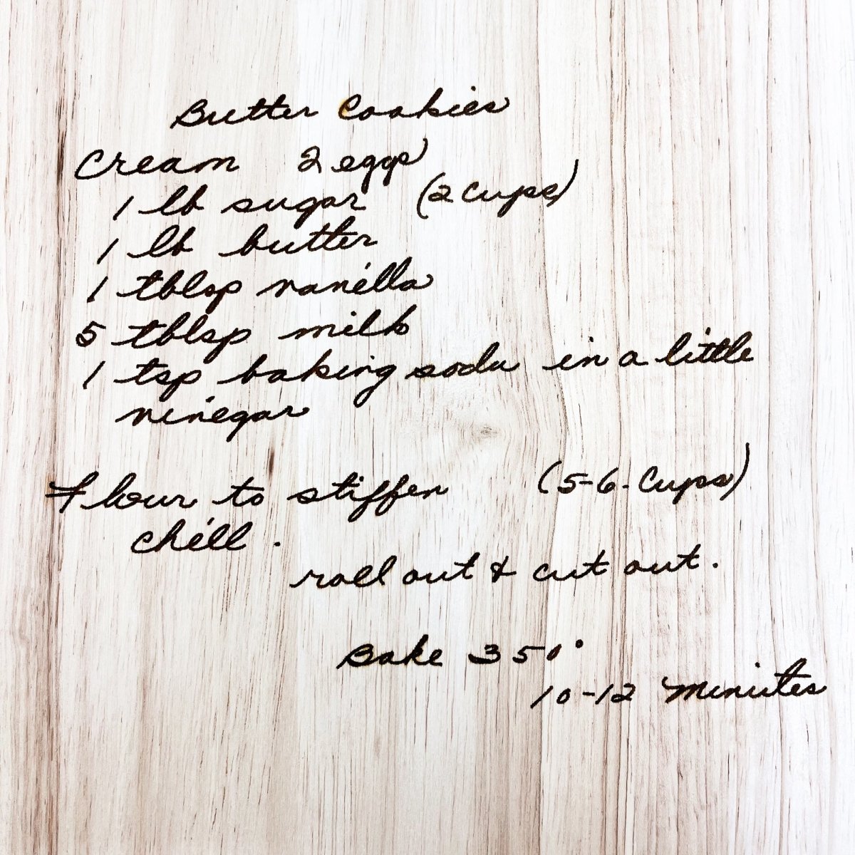 Custom Handwritten Cutting Board featuring a personalized handwritten recipe and decorative design, showcasing its unique craftsmanship.