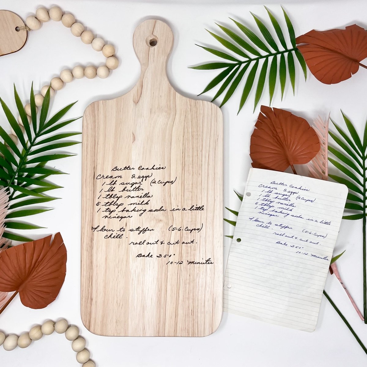 Custom Handwritten Cutting Board featuring a personalized handwritten recipe and decorative design, showcasing its unique craftsmanship.