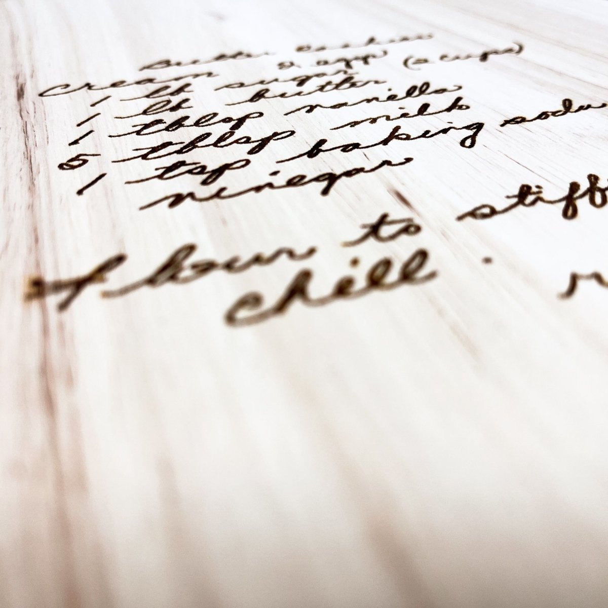 Custom Handwritten Cutting Board featuring a personalized handwritten recipe and decorative design, showcasing its unique craftsmanship.