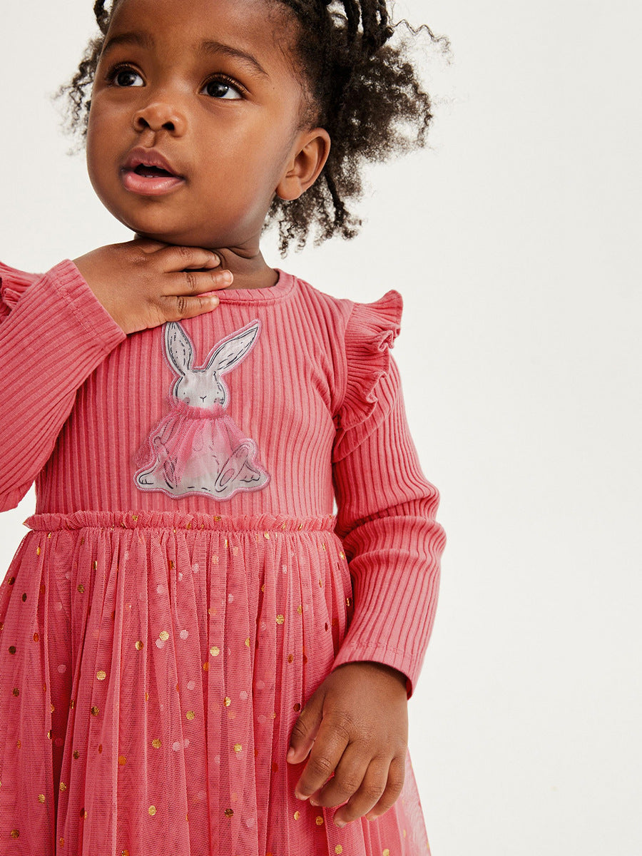 A vibrant red long sleeve shirt featuring a cute cartoon rabbit pattern, perfect for girls aged 12 months to 10 years.