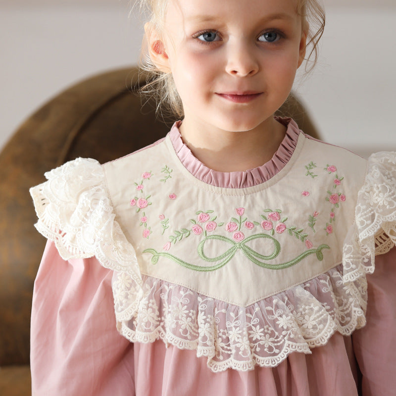 A pink long-sleeved top for girls featuring beautiful floral embroidery, made from soft cotton, perfect for spring and autumn wear.