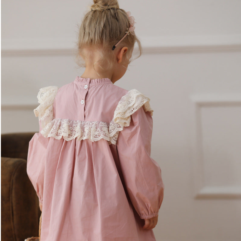 A pink long-sleeved top for girls featuring beautiful floral embroidery, made from soft cotton, perfect for spring and autumn wear.