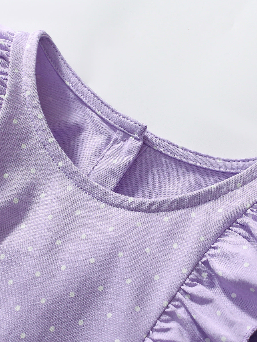 A vibrant purple long sleeve top featuring a unicorn cartoon design and dots pattern, perfect for girls aged 1-10.