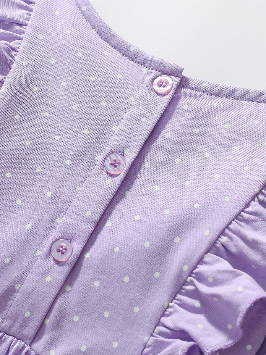 A vibrant purple long sleeve top featuring a unicorn cartoon design and dots pattern, perfect for girls aged 1-10.