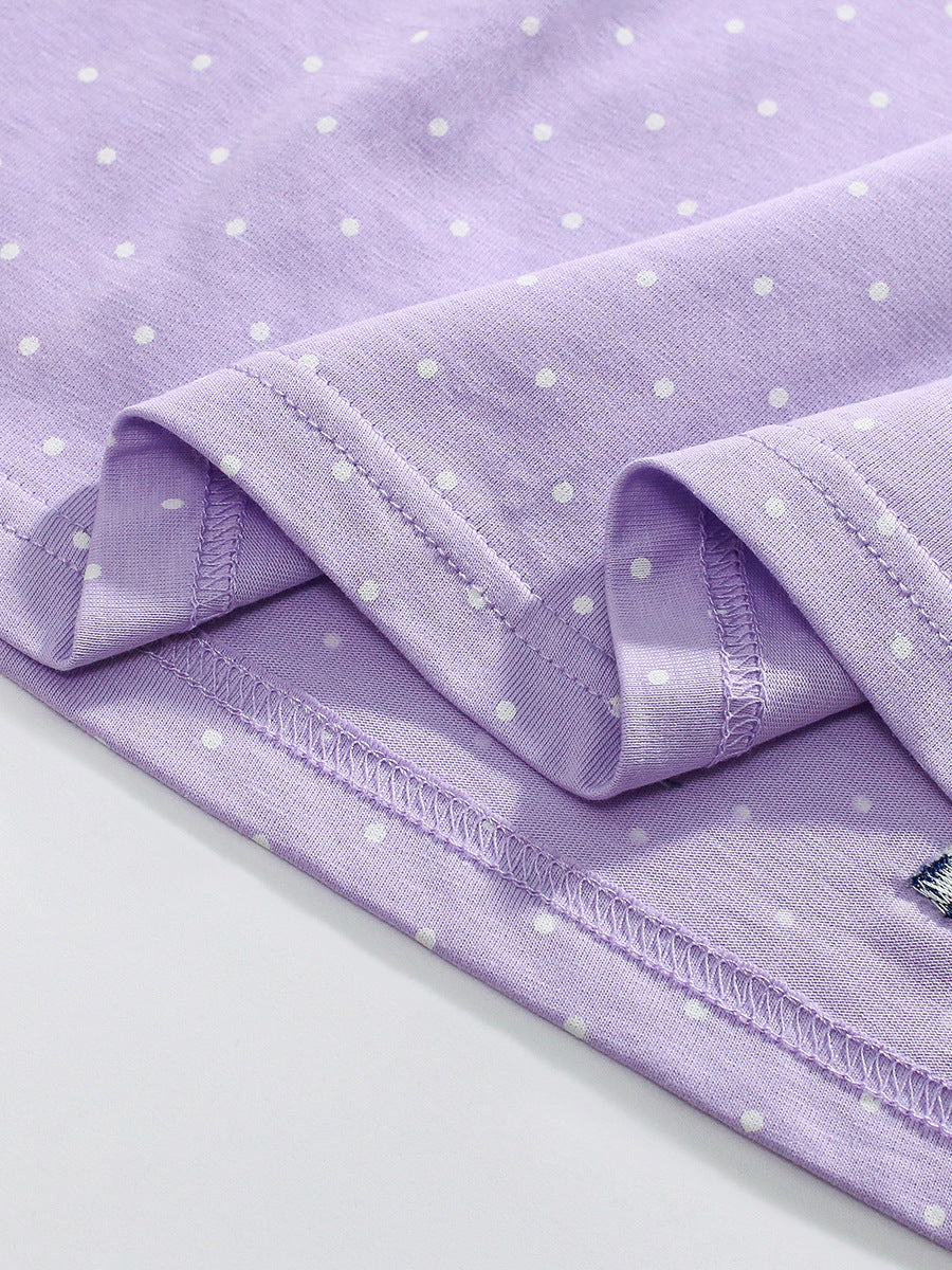 A vibrant purple long sleeve top featuring a unicorn cartoon design and dots pattern, perfect for girls aged 1-10.