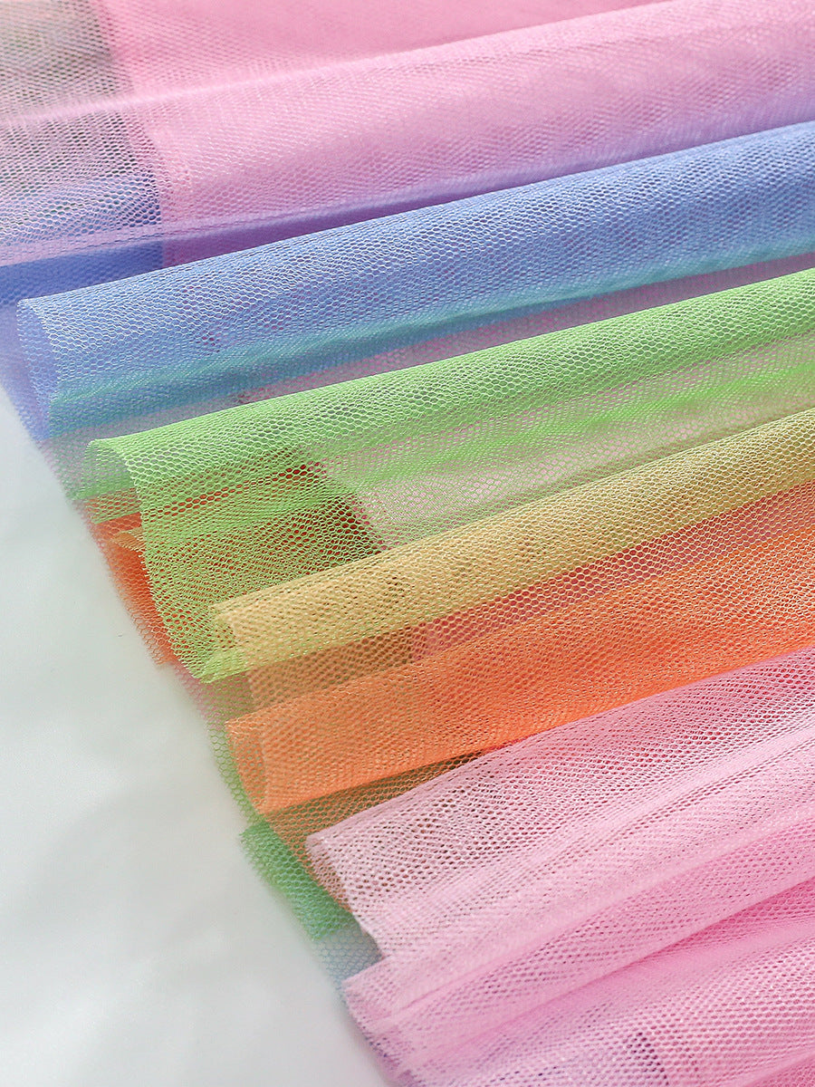 A pink long-sleeve crew neck top featuring a whimsical unicorn cartoon pattern, perfect for girls aged 12 months to 10 years.