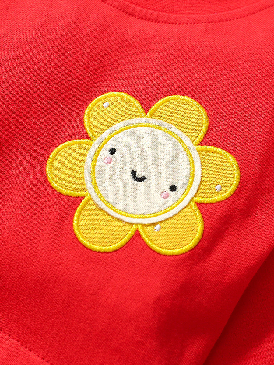 A vibrant red long dress for girls featuring floral and plaid patterns, perfect for autumn wear.