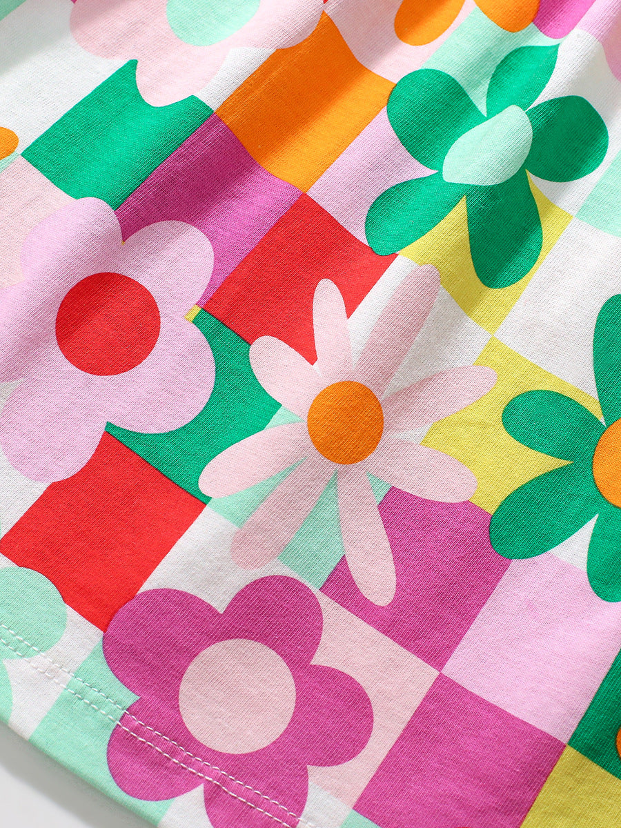 A vibrant red long dress for girls featuring floral and plaid patterns, perfect for autumn wear.