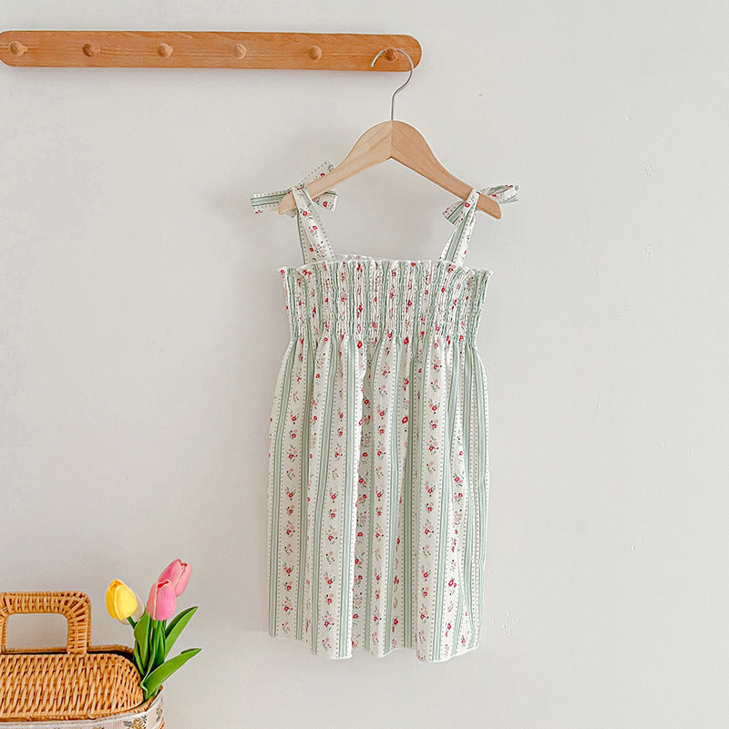 A vibrant summer dress for girls featuring floral and striped patterns, perfect for warm weather, available in pink and green colors.