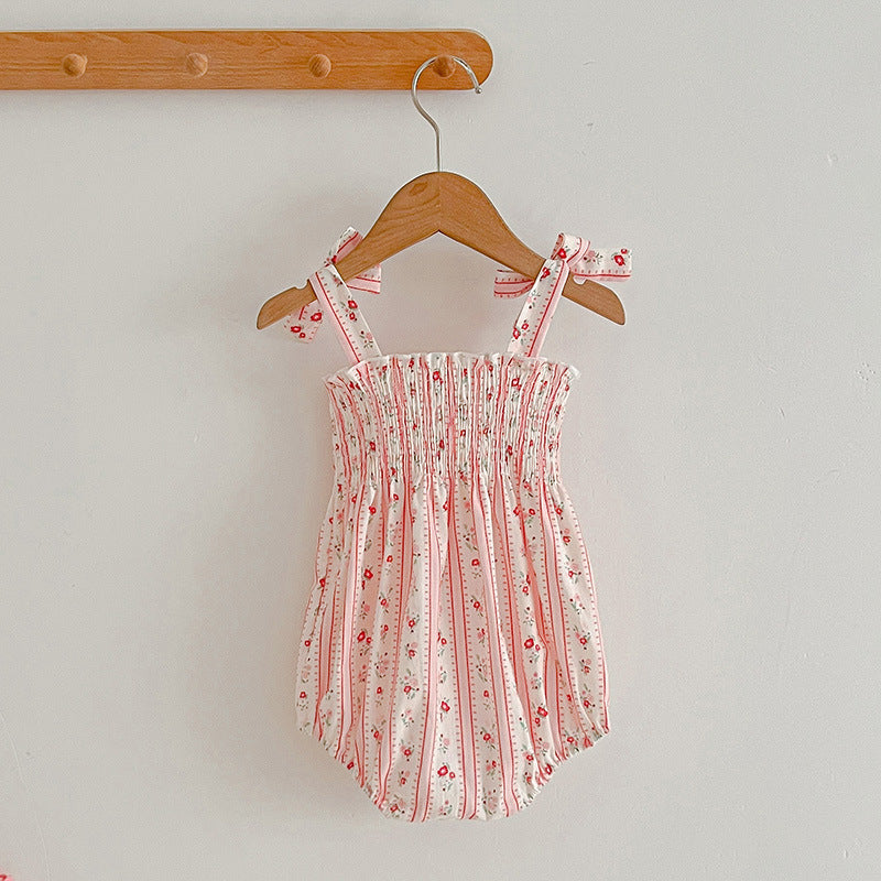 A vibrant summer dress for girls featuring floral and striped patterns, perfect for warm weather, available in pink and green colors.