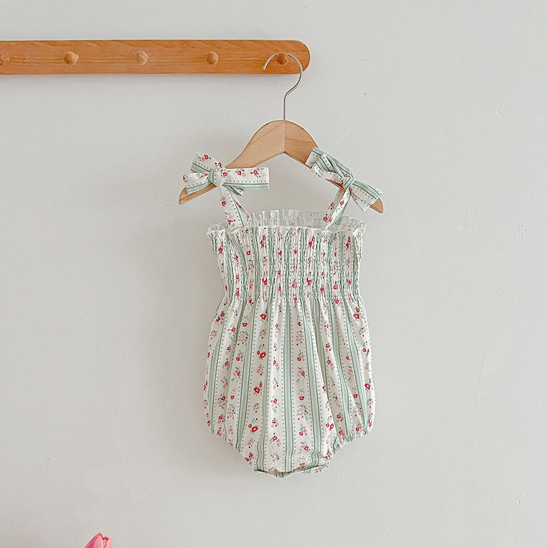 A vibrant summer dress for girls featuring floral and striped patterns, perfect for warm weather, available in pink and green colors.