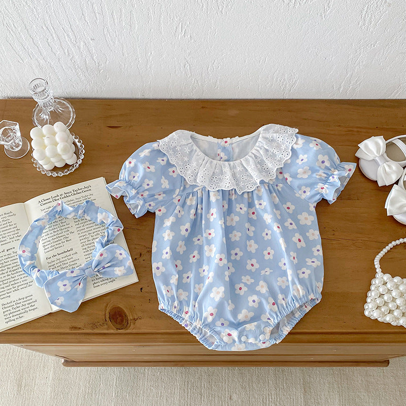 A cute summer dress for girls featuring a floral pattern, short sleeves, and a hollow out collar in blue and light blue colors.