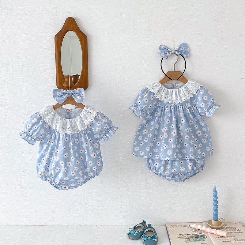 A cute summer dress for girls featuring a floral pattern, short sleeves, and a hollow out collar in blue and light blue colors.