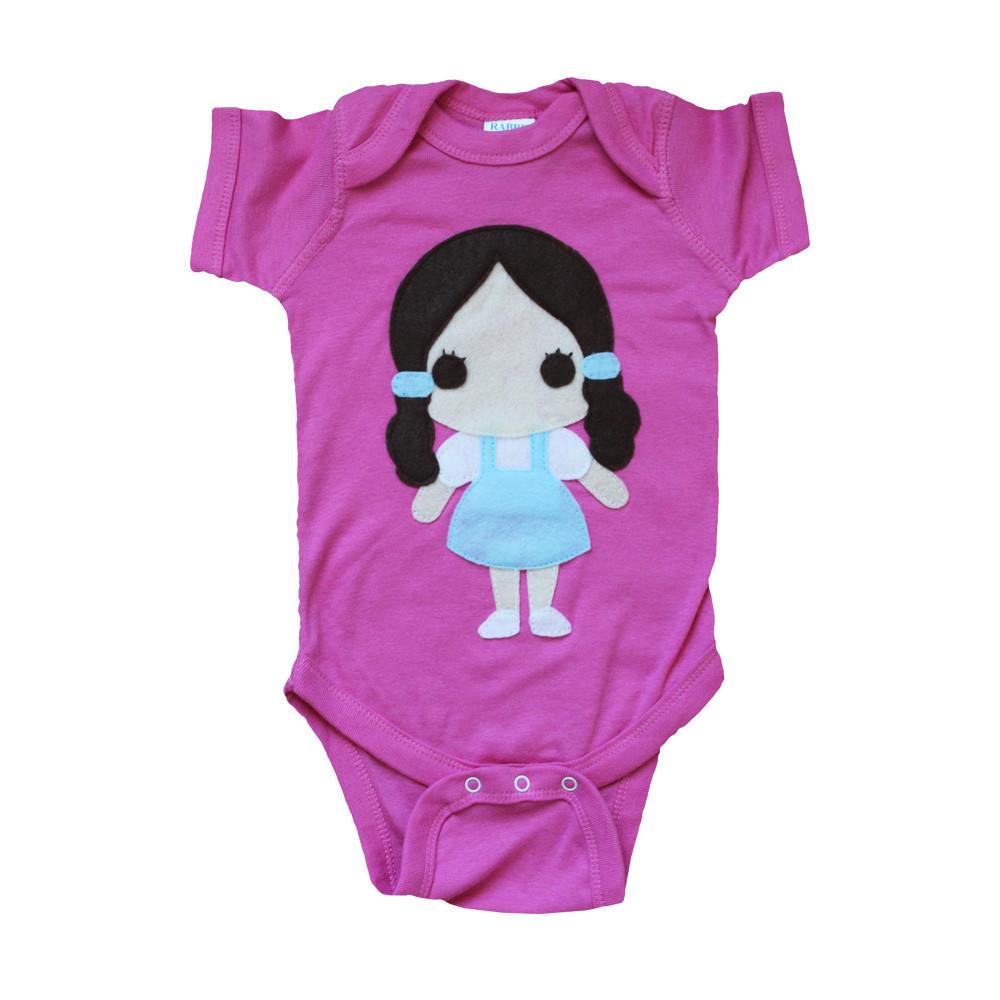 Adorable baby onesie featuring Dorothy from The Wizard of Oz, with eco-friendly felt appliqué design, perfect for little adventurers.