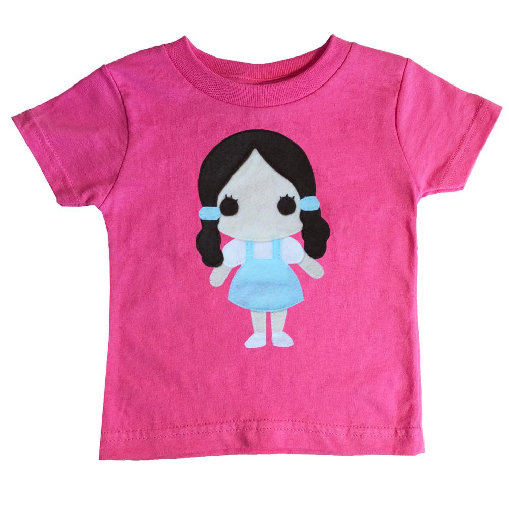A colorful toddler T-shirt featuring Dorothy from The Wonderful Wizard of Oz, with eco felt appliqué design, perfect for little adventurers.