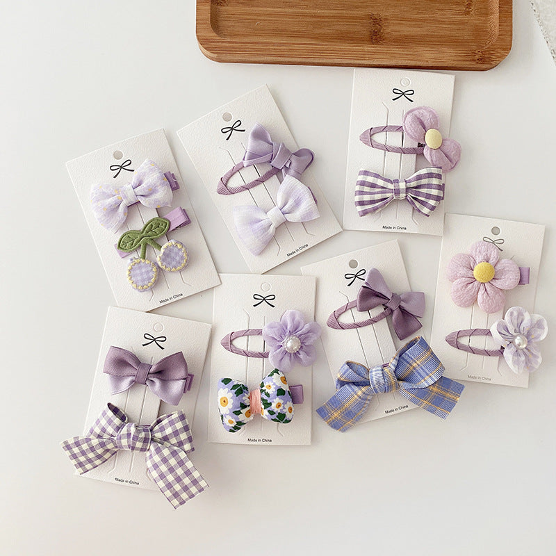 Dreamy Purple Collection Sweet Bow Hair Clip in various colors, featuring floral and plaid patterns, designed for baby girls and young girls.