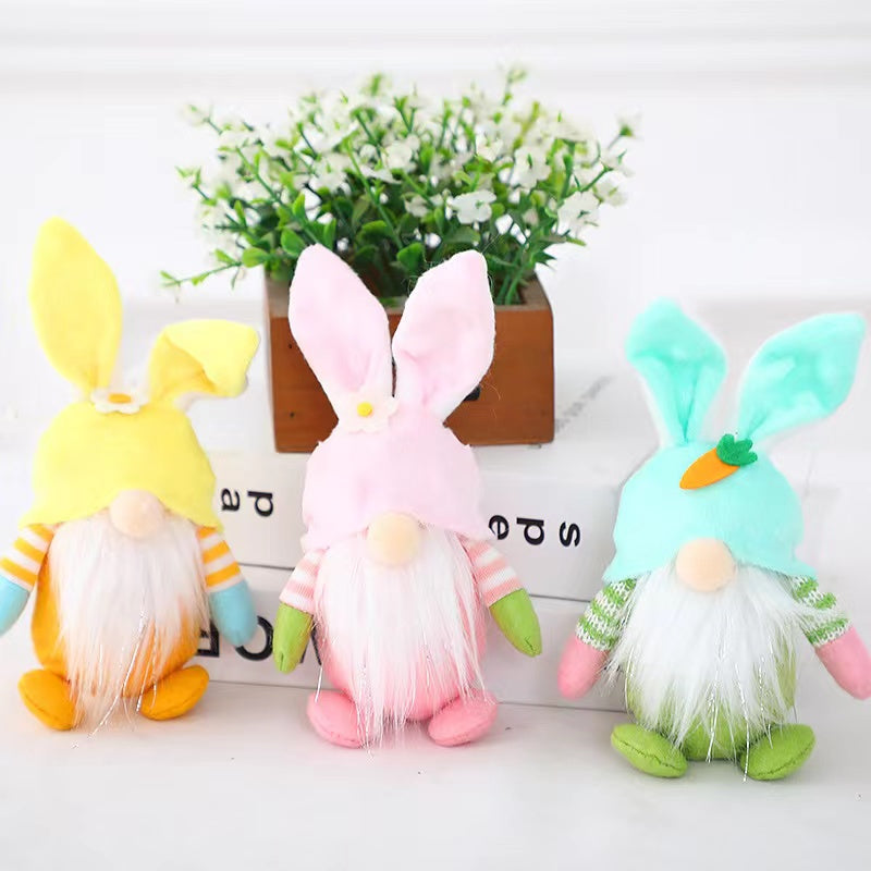 Colorful Easter Bunny Gnome Doll in pink, blue, green, and yellow, made from plastic and cloth, perfect for festive decorations.