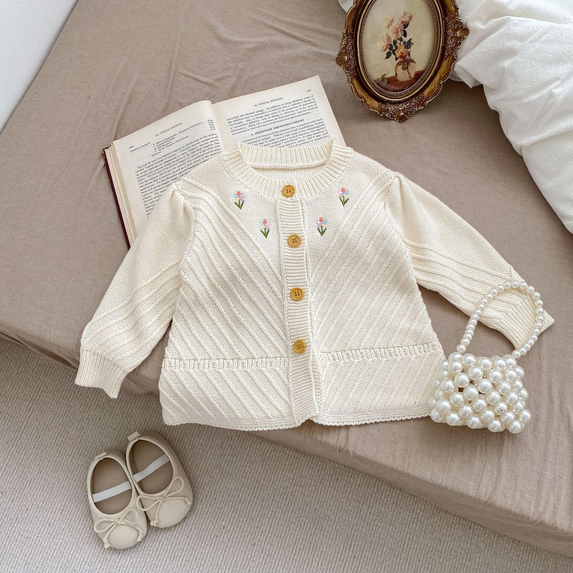 Embroidered Design High Quality Knit Cardigan in beige for baby girls, featuring floral embroidery and soft cotton material.