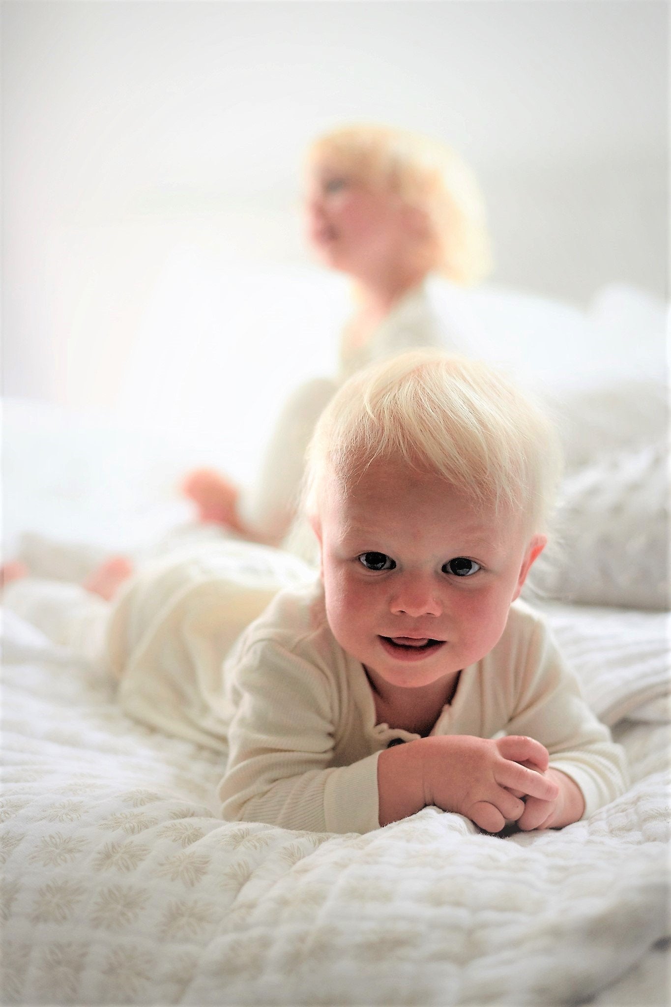 Flower Child Cotton Muslin Newcastle Blanket showcasing its soft, breathable, and cozy four-layer design in a vibrant pattern.