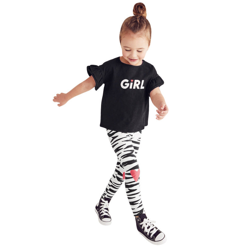 Girls black short flare sleeves t-shirt paired with striped pants, perfect for spring and summer wear.
