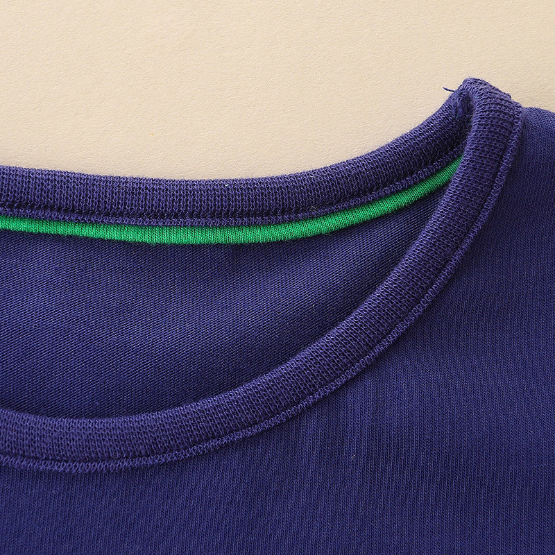 Girls’ Cartoon Pattern Embroidery Crew Neck Dress in vibrant colors with playful cartoon designs, made from soft cotton material.