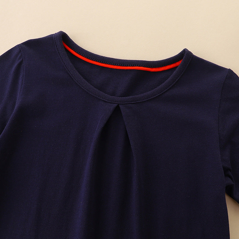 Girls’ Cartoon Pattern Embroidery Crew Neck Dress in vibrant colors with playful cartoon designs, made from soft cotton material.