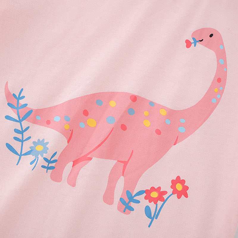 Girls’ pink t-shirt featuring a cartoon dinosaur print, perfect for summer wear.