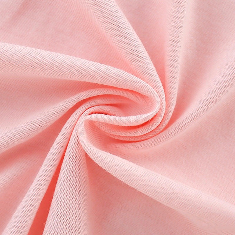 Girls’ pink t-shirt featuring a cartoon dinosaur print, perfect for summer wear.