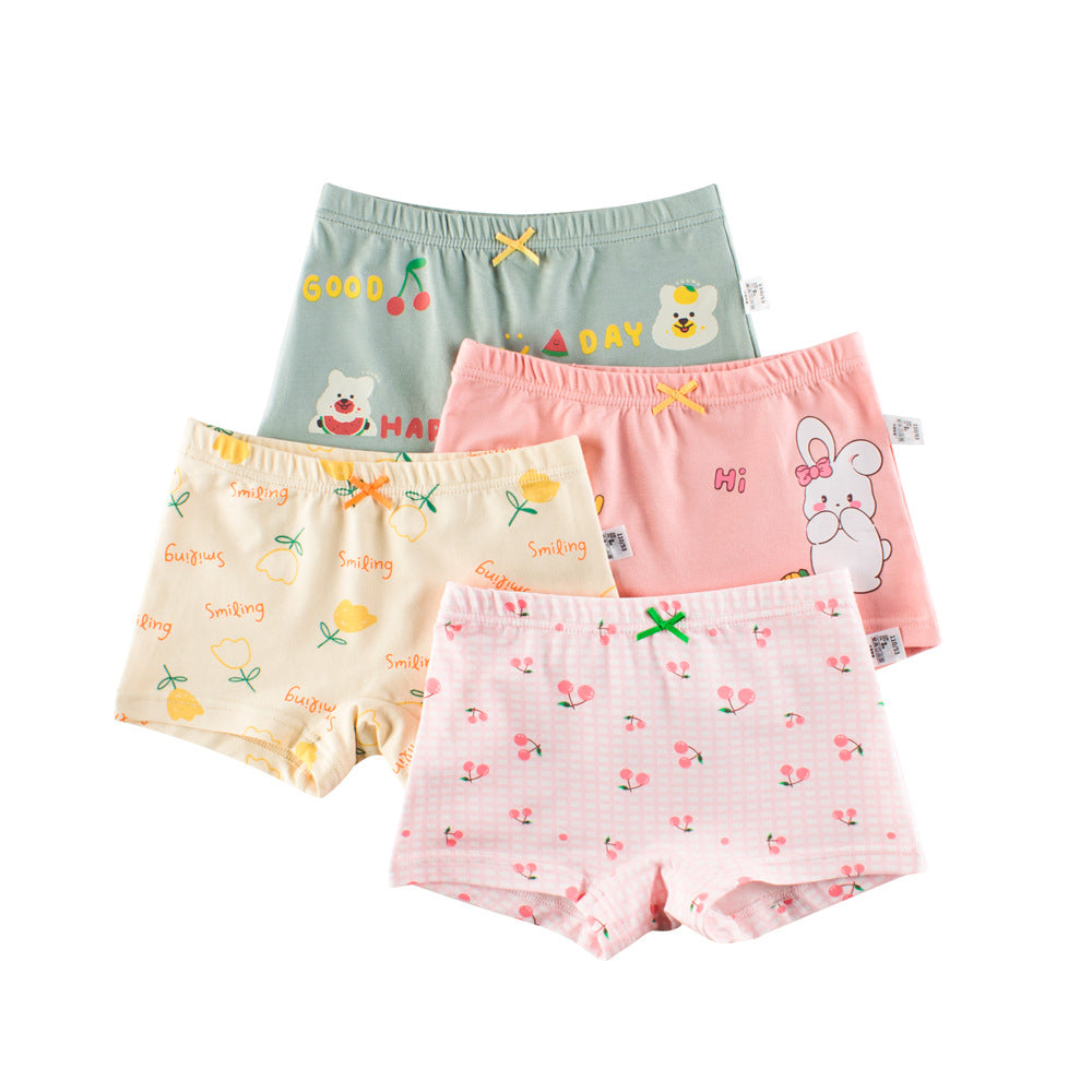 Girls' cartoon printed boxer shorts in pink and purple with playful designs, made from breathable cotton material.