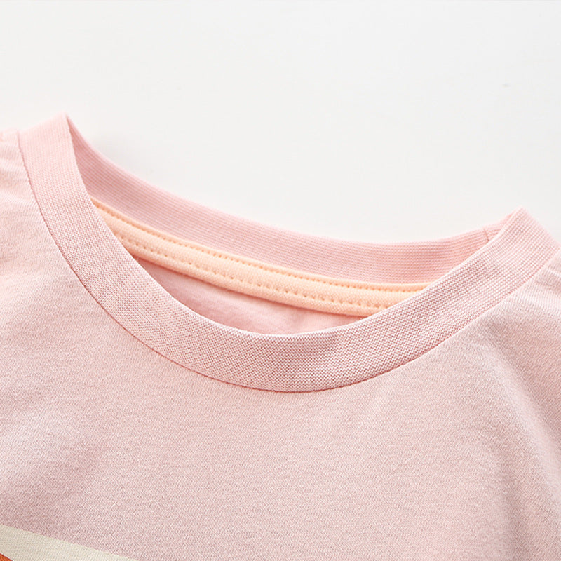 Girls' pink short sleeves t-shirt featuring a cartoon unicorn pattern, perfect for summer wear.