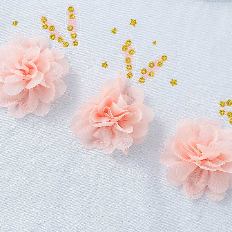 Girls’ summer clothing collection featuring floral patterns and sequins in vibrant blue color.