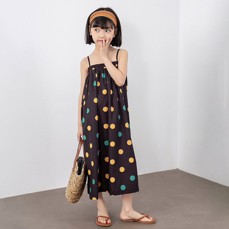 A vibrant girls' long dress featuring a colorful polka dot pattern, perfect for summer wear.
