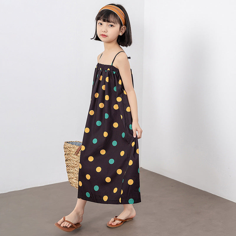 A vibrant girls' long dress featuring a colorful polka dot pattern, perfect for summer wear.