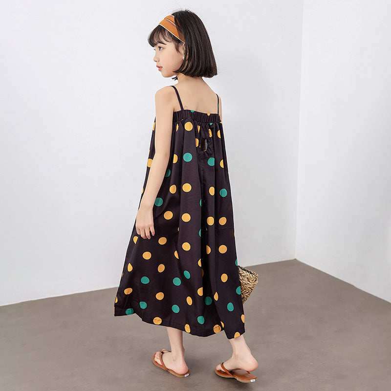 A vibrant girls' long dress featuring a colorful polka dot pattern, perfect for summer wear.