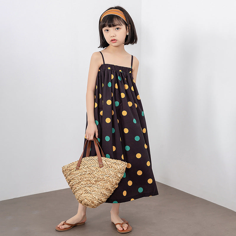 A vibrant girls' long dress featuring a colorful polka dot pattern, perfect for summer wear.