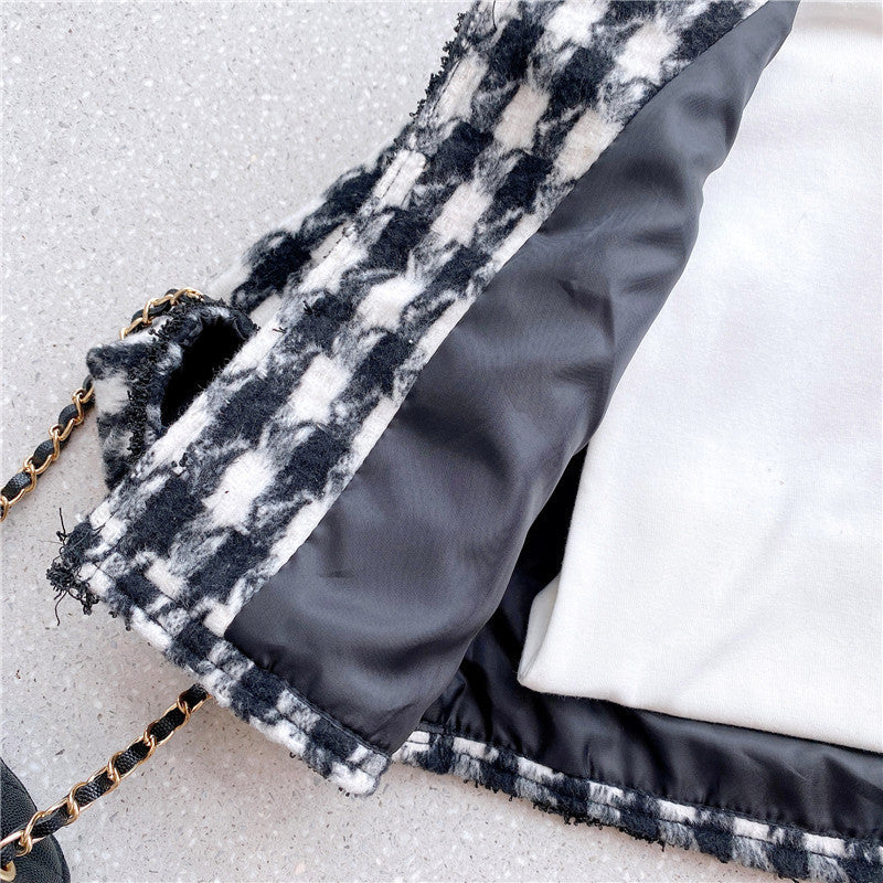 Girls elegant houndstooth pattern cardigan and skirt set in black, perfect for spring and autumn wear.