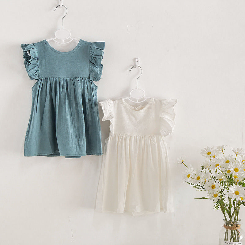 A stylish summer outfit for kids, featuring a solid color design in white and green, made from soft cotton for comfort.