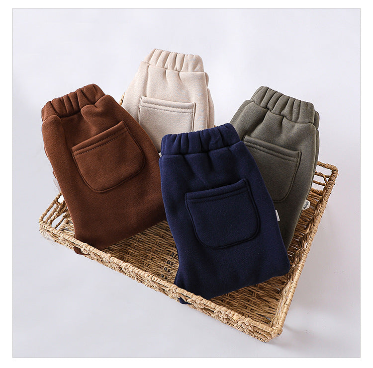 Infant baby girls velvet winter pants in four colors: navy blue, green, apricot, and brown, showcasing soft fabric and stylish design.
