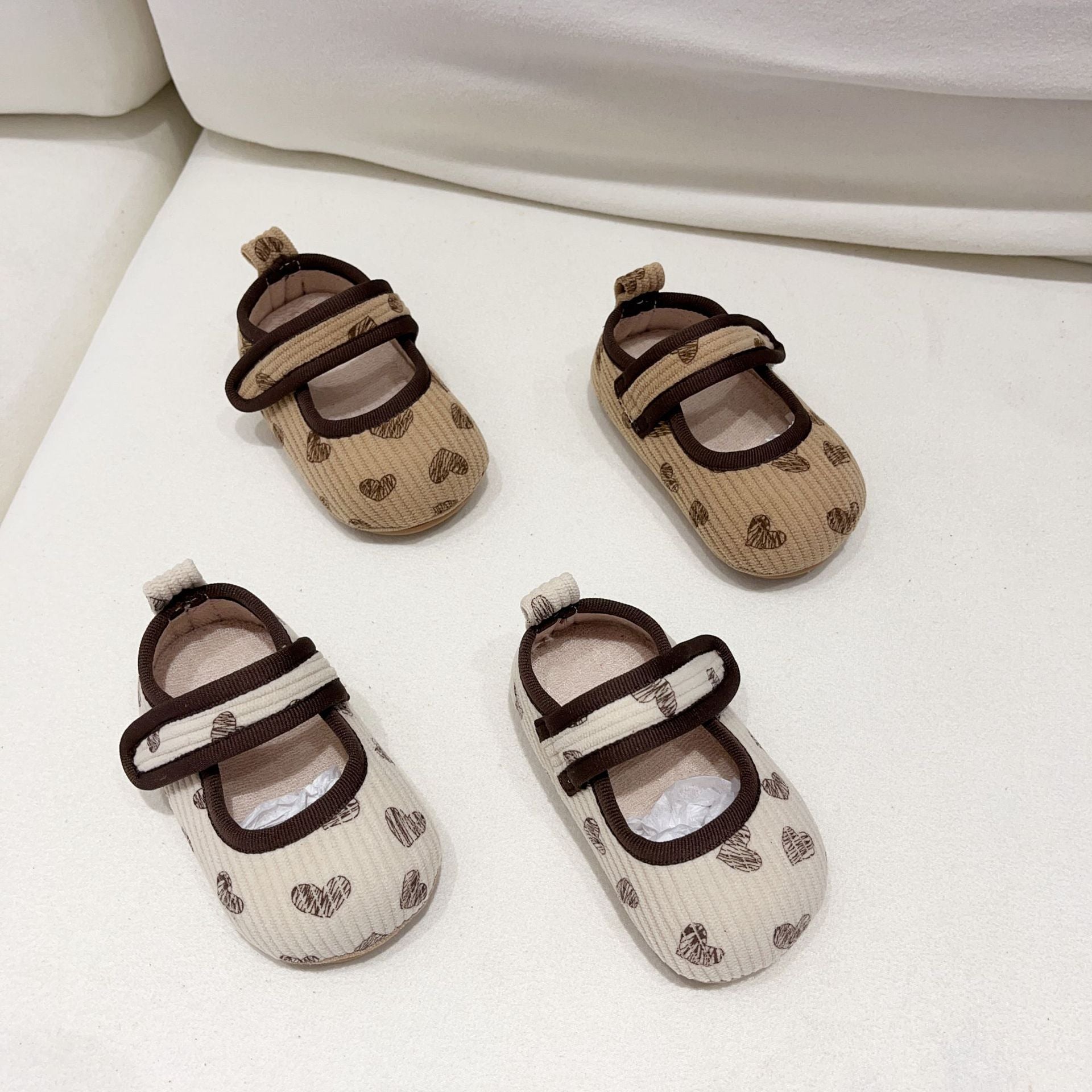 Ins Baby Girl Anti-Slip Shoes in beige and coffee colors with heart pattern, made from soft cotton cloth, perfect for autumn.