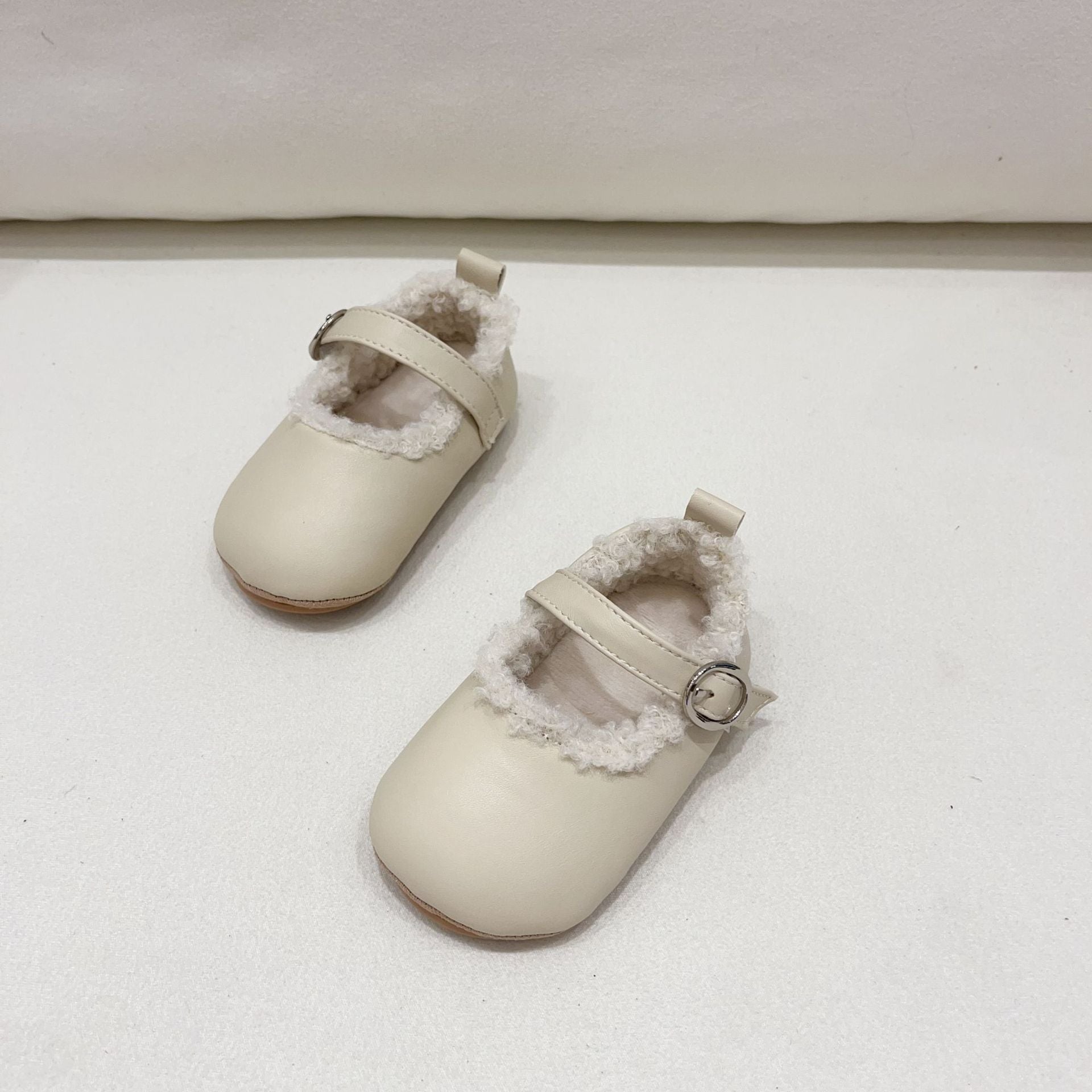 Infant baby girl plush warm anti-slip shoes in various colors including black, purple, yellow, beige, and brown, perfect for winter.